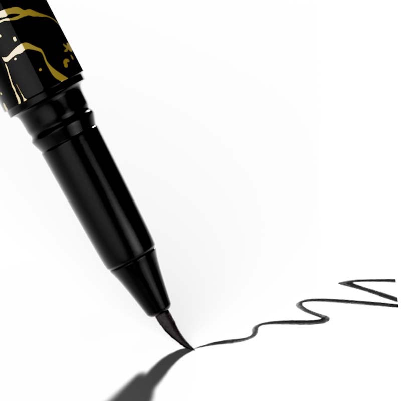 White background, Close up of Qudos eyeliner pen leaving a black curly line on the background's surface