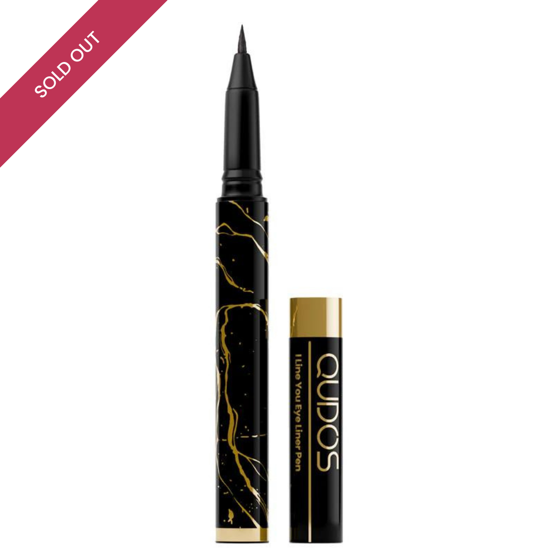 Standing up Qudos eyeliner pen with lid placed on right-hand side