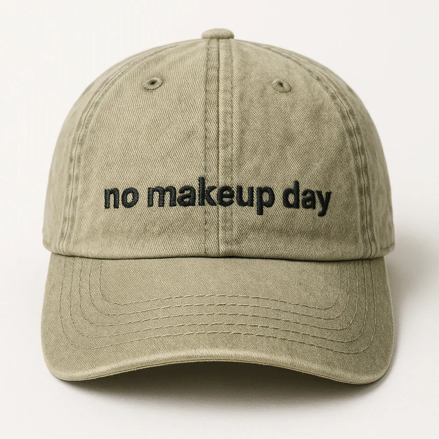 Qudos Beige Muse Cap with 'no makeup day' text - front view