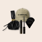 The Qudos Premium Gift: Qudos Makeup Bag, I Wand You Mascara, Synergy Powder Puff Duo and No Make Up Day Cap
